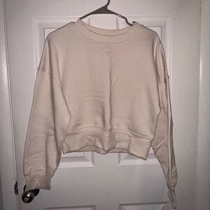 Cream cropped crew neck sweatshirt. Size M.